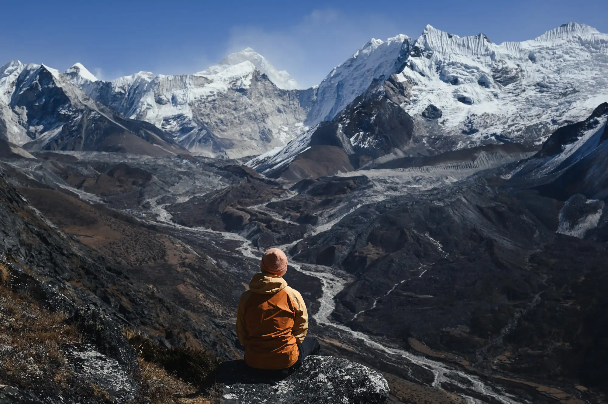 Mountain landscape with a seated traveler